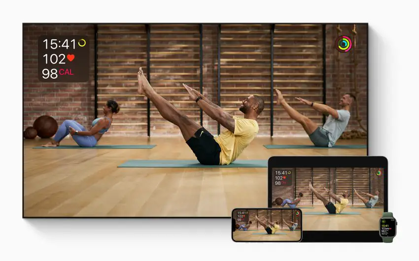 Ansicht des Abodienstes Apple Fitness+ auf dem TV, Laptop, Smartphone und watch. Zusehen ist eine geführte Trainingseinheit.