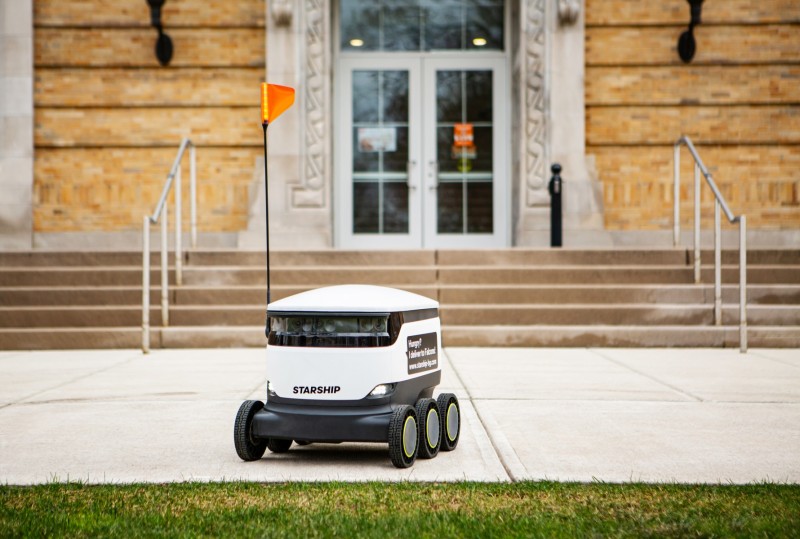 Illustration of the robot in front of the university